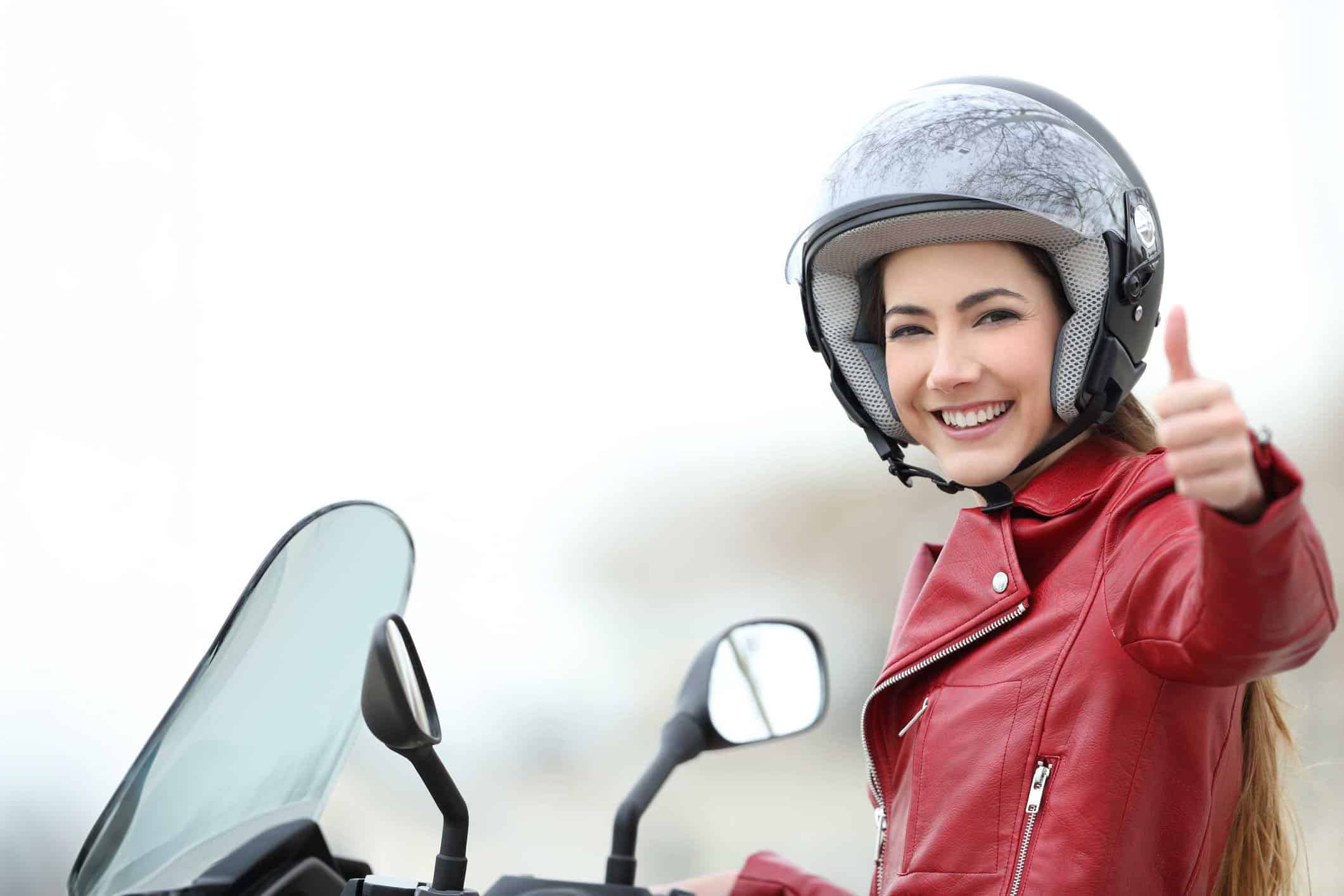 Satisfied motorbiker gesturing thumbs up